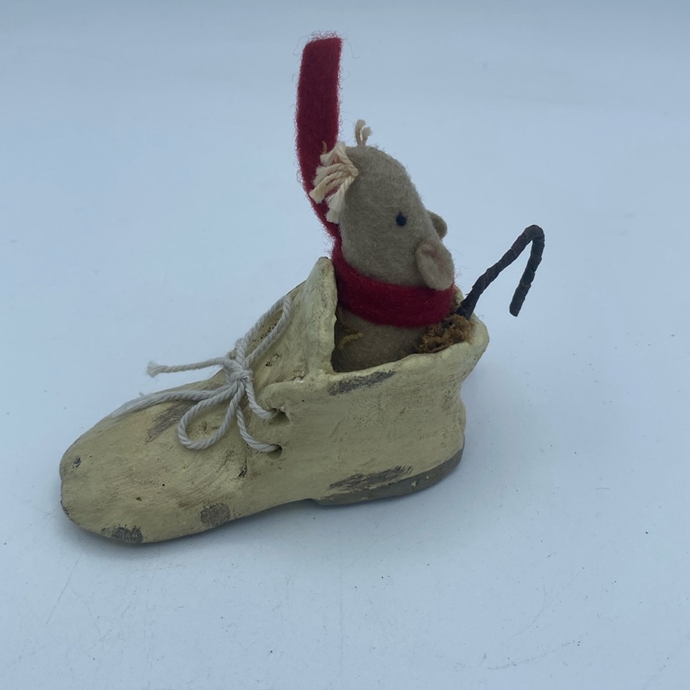 Miniature resin ceramic baby shoe with cute felt mouse nestled in decor